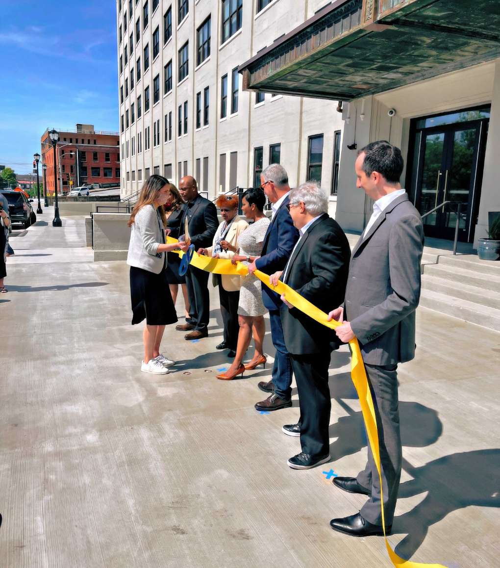 cutting the ribbon at an office building